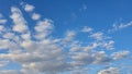 Blue sky with clouds, flying birds and green branches. Summer nature. Road. Royalty Free Stock Photo