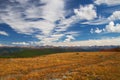 Blue sky, clouds and mountains.