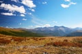 Blue sky, clouds and mountains.