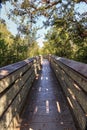 Blue sky and clouds over a bridge that crosses Henderson Creek, which runs through Rookery Bay