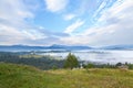 Blue sky with clouds over green meadows and mountains. Ukraine, Carpathians Royalty Free Stock Photo