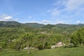 Blue sky with clouds over mountain village Royalty Free Stock Photo