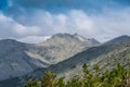 Blue sky and clouds over the rocks Royalty Free Stock Photo