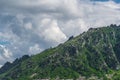 Blue sky and clouds over the rocks Royalty Free Stock Photo