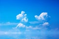 Blue sky with clouds over sea. Summer background Royalty Free Stock Photo