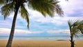 Blue sky and clouds over a tropical beach with green palm trees in Playa Larga, Cuba Royalty Free Stock Photo