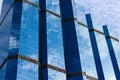 Blue sky and clouds reflected on the glass of office business buildings in the city center on a bright sunny day Royalty Free Stock Photo