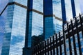 Blue sky and clouds reflected on the glass of office business buildings in the city center on a bright sunny day Royalty Free Stock Photo