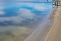 Blue sky and clouds reflected in still bay waters, Tybee Island Georgia USA Royalty Free Stock Photo