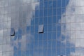 Blue sky and clouds reflected in windows Royalty Free Stock Photo