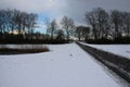 The bridge and the park under the snow in the winter.