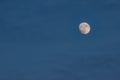 Blue sky with clouds and a round full moon. A beautiful night sky. Moonlight evening light Royalty Free Stock Photo