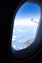 Blue Sky and Clouds Seen Through an Airplane Window