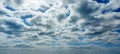 A blue sky with clouds with silver lining. Royalty Free Stock Photo