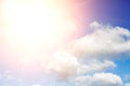 Beautiful blue sky with clouds and sun with rays of light Royalty Free Stock Photo