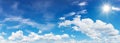 blue sky with clouds and sun reflection.The sun shines bright in Royalty Free Stock Photo
