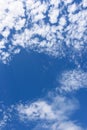 The blue sky with clouds and the sun`s rays as a background Royalty Free Stock Photo