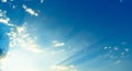 Blue sky with clouds and sun`s rays, background Royalty Free Stock Photo