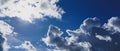 Blue sky with clouds and sun shines bright Royalty Free Stock Photo