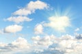 Blue sky with clouds and sun, sunlight, rays Royalty Free Stock Photo