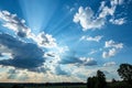 Blue sky with clouds and sunlight creating abstract shapes Royalty Free Stock Photo