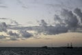 Blue sky with clouds and sea with boats in the sunset background Royalty Free Stock Photo