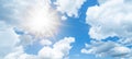 Blue sky, cloudscae background banner panorama , with clouds and sun reflection / sunshine sunbeams Royalty Free Stock Photo