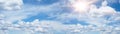 Blue sky, cloudscape background banner panorama , with clouds and sun reflection / sunshine sunbeams - summer weather Royalty Free Stock Photo