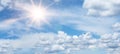 Blue sky, cloudscape background banner panorama , with clouds and sun reflection / sunshine sunbeams - summer weather Royalty Free Stock Photo