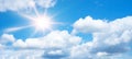 Blue sky, cloudscape background banner panorama , with clouds and sun reflection / sunshine sunbeams - summer weather Royalty Free Stock Photo