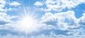 Blue sky, cloudscape background banner panorama , with clouds and sun reflection / sunshine sunbeams - summer weather Royalty Free Stock Photo