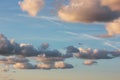 Blue sky, colorful clouds, traces plane and sunlight. Background template. Background with blue, white and gray shades. Royalty Free Stock Photo