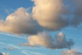 Blue sky, colorful clouds, traces plane and sunlight. Background template. Background with blue, white and gray shades. Royalty Free Stock Photo