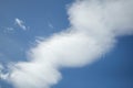 blue sky with diagonal wavy clouds