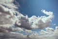 Cumulus clouds illuminated by bright sunlight in blue sky Royalty Free Stock Photo
