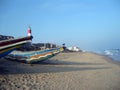 Blue sky, empty sea beach and decorated boats on a tourist spot. Royalty Free Stock Photo