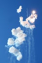 Blue sky with fireworks firecrackers white clouds