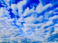 Blue sky with floating cirrus clouds