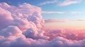 Blue sky with fluffy pink clouds at sunset, dawn of the day. Warm pastel colors, serene romantic background. Royalty Free Stock Photo