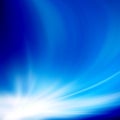 Blue sky with glaring sun. Abstract background, asymmetric light burst with the center in the upper left third. Use of linear and