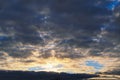 Blue sky with gold clouds - dramatic sunset, beautiful natural background. Setting sun illuminates the clouds Royalty Free Stock Photo