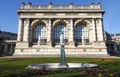 Blue sky and green grass the perfect backdrop for beautiful old architecture and fountain statue at the Square du Palais Royalty Free Stock Photo