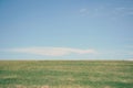 Blue sky and green grass sunshine blank landscape background