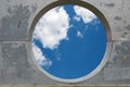 Blue sky hole in aged concrete wall background