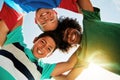 Blue sky, low angle and happy portrait of kids for friendship, playing and fun together. Diversity, youth and boys Royalty Free Stock Photo