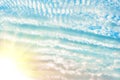 Blue sky and many small clouds with sun rays can be used as a background Royalty Free Stock Photo