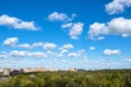 Blue sky with many white clouds over park and city Royalty Free Stock Photo