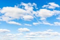 Blue sky with many white cumuli clouds