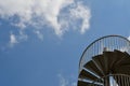 Blue sky and metal spiral staircase Royalty Free Stock Photo