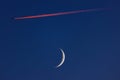 Blue sky with moon and flying airplane Royalty Free Stock Photo